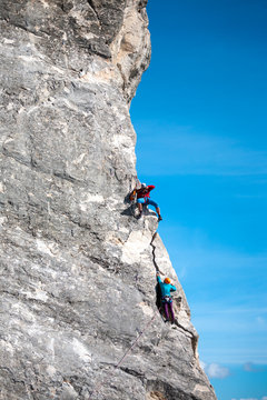 Photographer shoots climbers. © zhukovvvlad