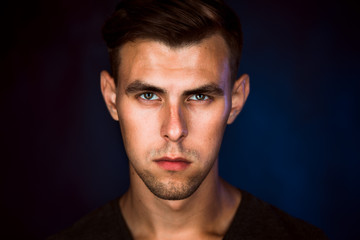 Portrait of a young man on a dark background