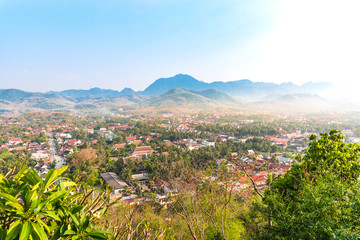 Top view of Luang Prabang City with clear sky and sunshine from high mountain at Phousi Hill, Luang Prabang, Laos.