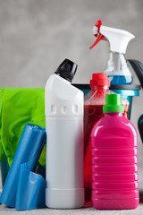 Cleaning supplies on grey background