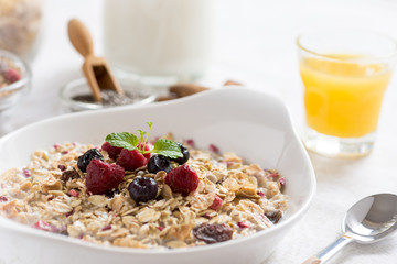 Healthy Breakfast Muesli With Milk, Chia Seeds, Berries and Cinnamon. Sunny Morning.