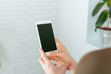 close up of woman texting on smartphone