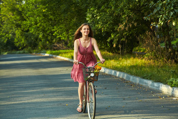 Naklejka premium woman riding a bike. motion blur