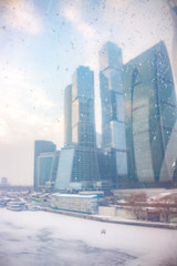 Business Center "Moskva Siti" through the window of the pedestrian bridge Bagration, blurred
