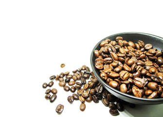 Natural Roasted Coffee beans isolated in black bowl on white background