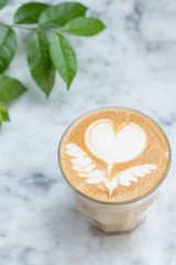 Top view of Hot Latte coffee with white cup and a spoon