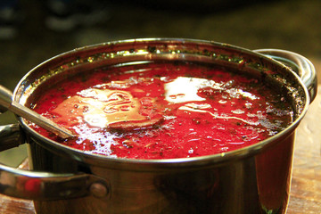 Traditional Ukrainian borscht. Borsch Ukrainian red in pan with scoop