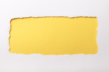 Ripped white paper with colored background with space for text