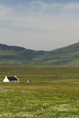 Fototapeta na wymiar Rural house in scottish highlands with landscape