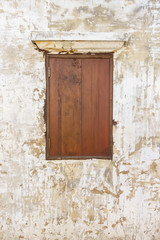 Fototapeta na wymiar Old grunge wall with wooden window