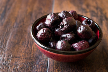 Dried Black Olive Chips / Crackers without seeds in Bowl.