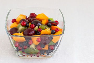 Salad of fresh berries and fruits in a bowl.