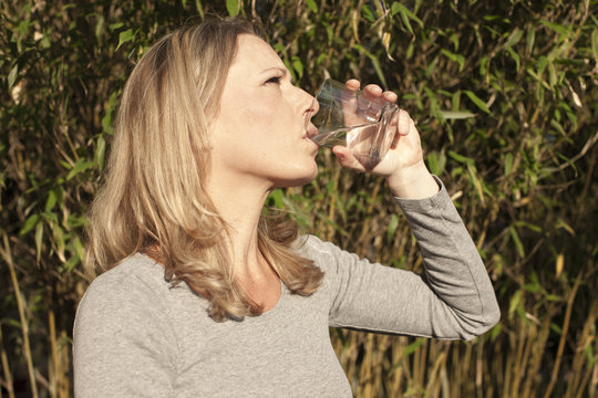 Woman drinking a glass of water,42 years