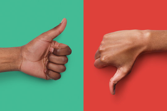 Black hands with thumb up and down gestures
