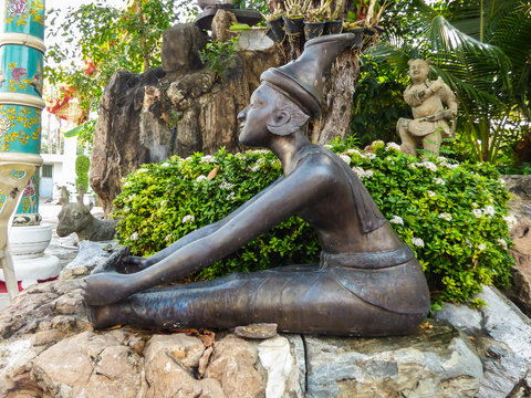 Bangkok, Thailand - Circa January 2018: Statue depicting a Reusi Dat Ton (Thai Yoga) pose at the famous Wat Pho (Buddhist Temple)