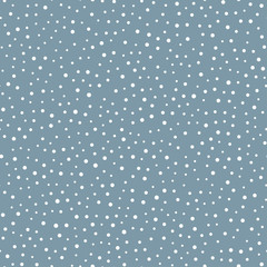 White snowflakes on a blue background. Seamless pattern