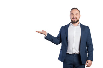 Business man portrait on a white background. The guy is holding his hand, showing something