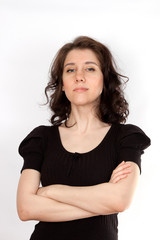 A young woman in a black dress looks appreciatively, skeptical and proudly