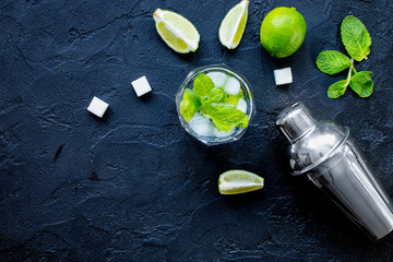 making mojito on dark background top view