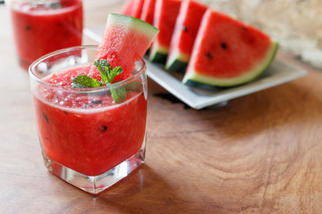 Watermelon drink on wooden background.