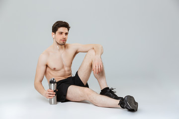 Portrait of a handsome young half naked sportsman
