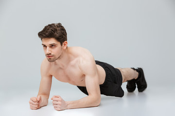 Fototapeta premium Portrait of a concentrated young half naked sportsman