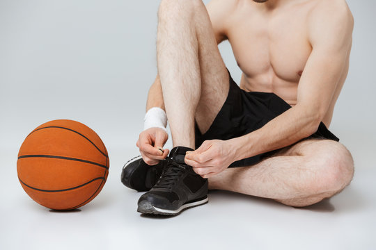 Cropped image of a young half naked sportsman