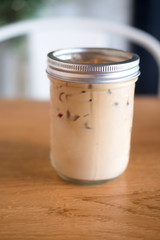 Iced coffee in glass on table in cafe or restaurant