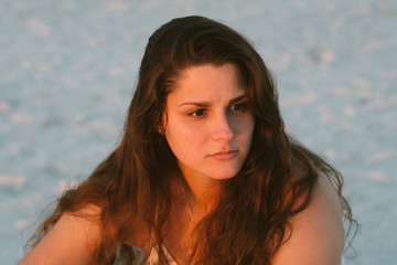 Attractive Model With Long Curly Hair Modeling on the Beach
