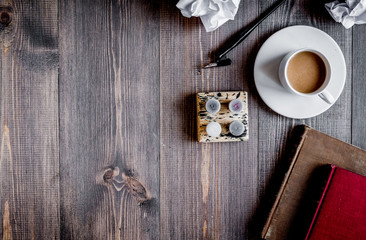 writier tools in profession concept on woode background top view