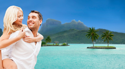 travel, tourism and summer holidays concept - happy couple having fun at touristic resort over...