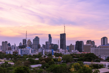 Obraz premium Bangkok business district cityscape with skyscraper at twilight, Thailand.