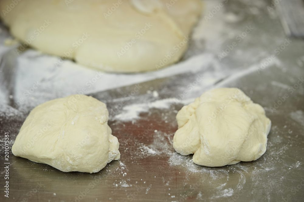 Wall mural cutting bread dough