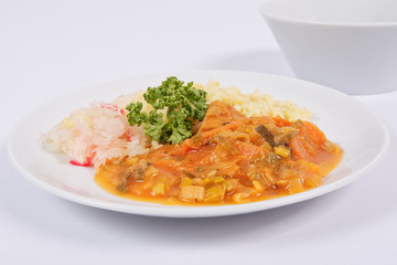 Seitan goulash with bulgur on a white