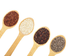 Black red white quinoa and chia seeds in wooden spoon isolated on white background with copy space for your text