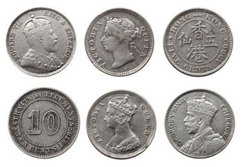 Old silver coins collection isolated on a white background.