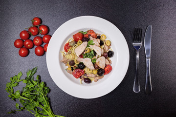 Spaghetti with Mediterranean tuna, capers, olives, Sicilian chilli pepper, cherry tomatoes and a sprinkling of parsley