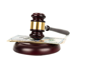 Wooden judge gavel and dollar money banknote on white background