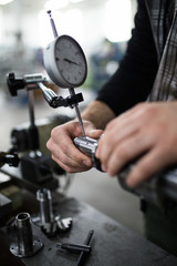 Metallurgy heavy industry. Factory for production of special industrial tools. Worker hands close up.