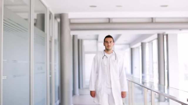 Young Doctor Walking Through Hospital Indoor