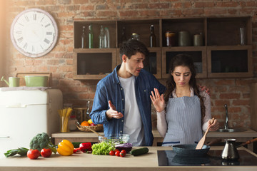 Couple cooking healthy dinner together