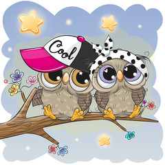 Obraz premium Cute Owls is sitting on a branch
