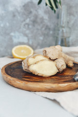 Fresh ginger and lemon on wooden