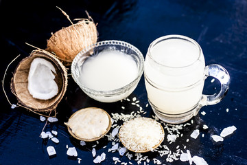 Close up of famous regional drink of India apong shrabat or tender coconut shrabat on wooden surface with the entire ingredients.