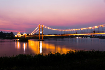 Beautiful landscape of hanging bridge across the Ping river at Evening ,Tak Province,Thailand