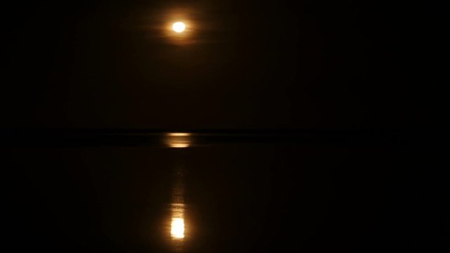 Full moon reflection in sea in Puerto Princesa, Philippines, time lapse