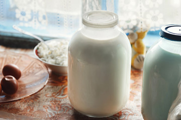 Jar of fresh homemade milk on the table. Rustic style