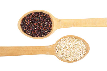 Black and white quinoa seeds in wooden spoon isolated on white background. Top view