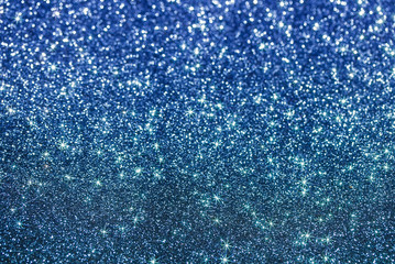blue beautiful festive silver shiny background of bright sparks and shimmering stars and circles