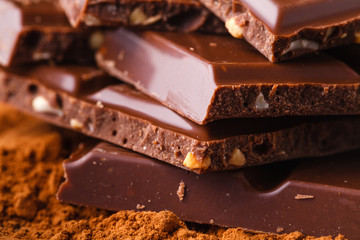 close up of chocolate pieces on wooden background